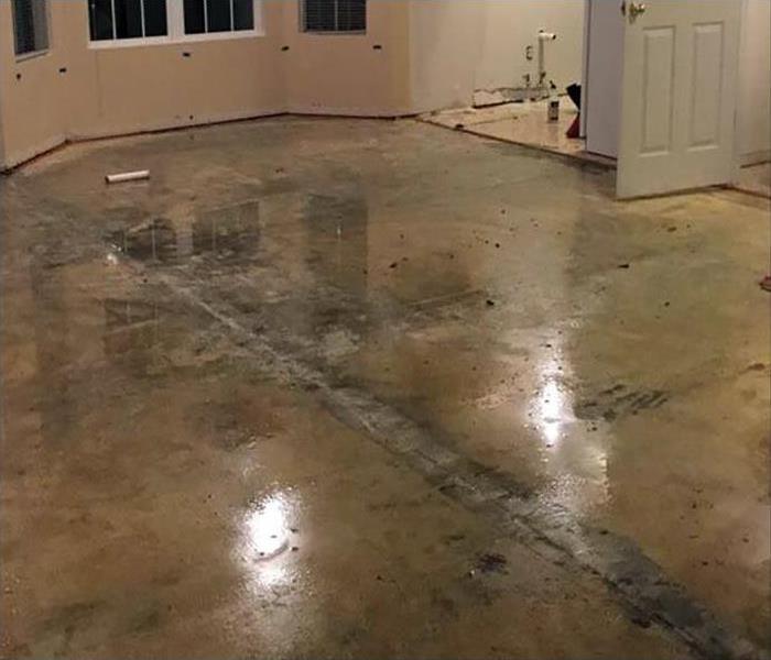 Standing water on the floor of an apartment